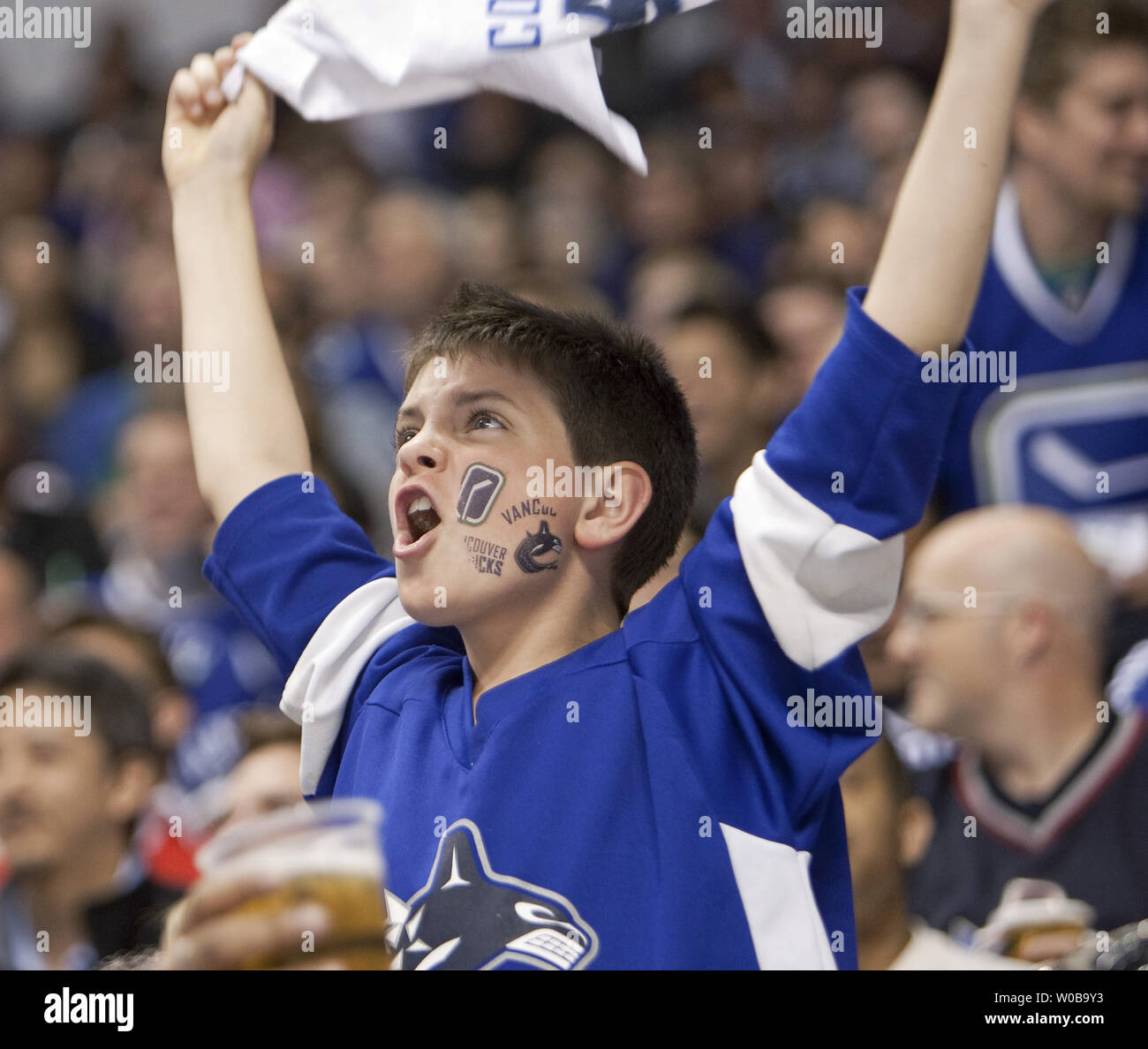 Vancouver Canucks fans cheer as their team scores against the San Jose Sharks during the first period of the second game of the Western Conference finals at Rogers Arena in Vancouver British Columbia on May 18, 2011.  UPI/Heinz Ruckemann Stock Photo