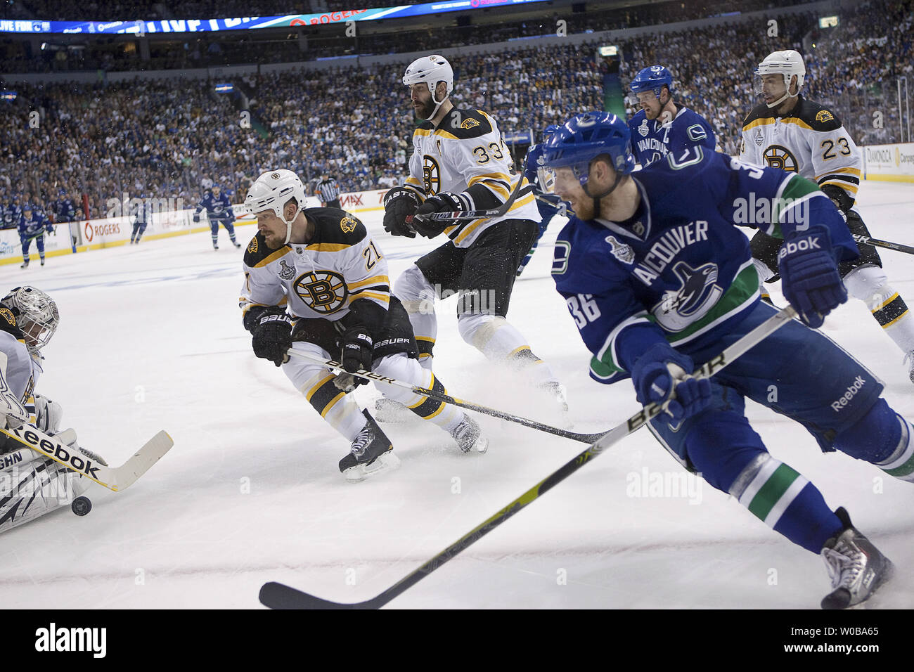 https://c8.alamy.com/comp/W0BA65/boston-bruins-goalie-tim-thomas-makes-a-save-on-vancouver-canucks-jannik-hansen-ahead-of-teammates-andrew-ference-21-and-zdeno-chara-33-during-the-first-period-of-the-fifth-game-of-the-stanley-cup-final-at-rogers-arena-in-vancouver-british-columbia-on-june-10-2011-upiheinz-ruckemann-W0BA65.jpg