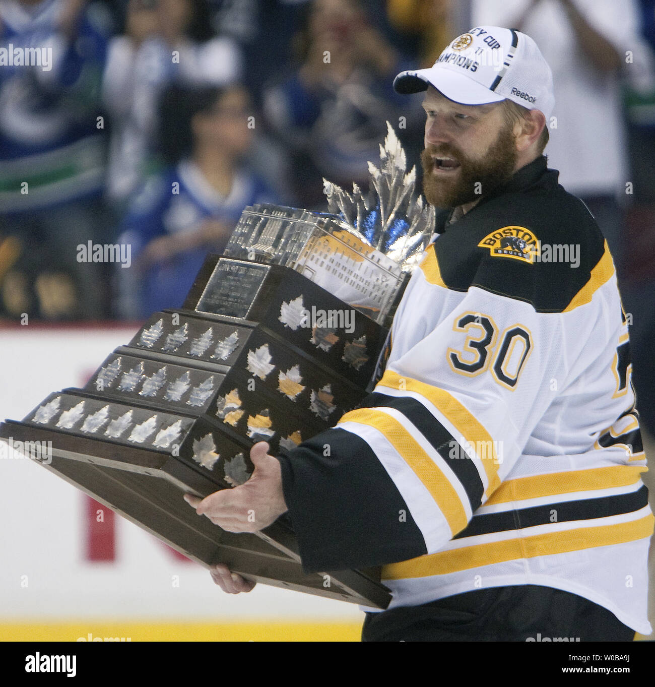 Boston Bruins goalie Tim Thomas wins the Conn Smythe trophy as his team celebrates after beating the Vancouver Canucks 4-0 in game seven of the Stanley Cup Final at Rogers Arena, Vancouver, British Columbia, June 15, 2011.  UPI/Heinz Ruckemann Stock Photo