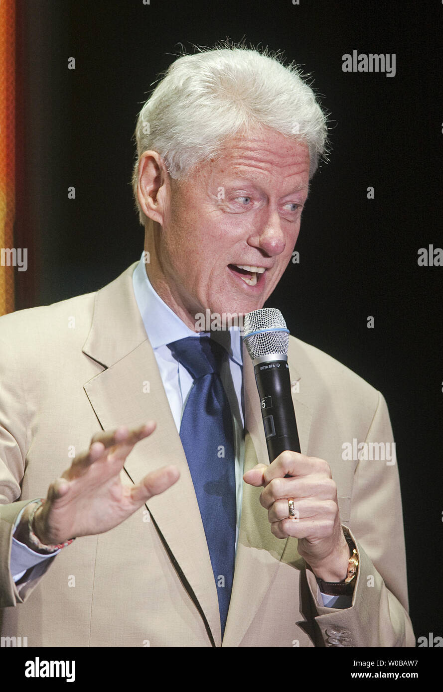 Former President Bill Clinton speaks during Sarah McLachlan's Voices in the Park benefit concert in Stanley Park, Vancouver, British Columbia on September 15, 2012. Funds raised from the concert will support The Sarah McLachlan School of Music.   UPI Photo /Heinz Ruckemann Stock Photo