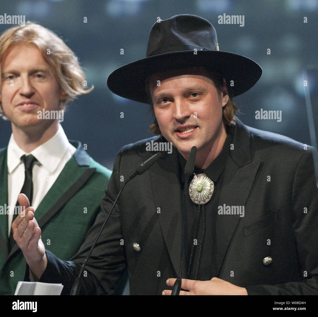 Lead singer Win Butler speaks for Arcade Fire after they receive the