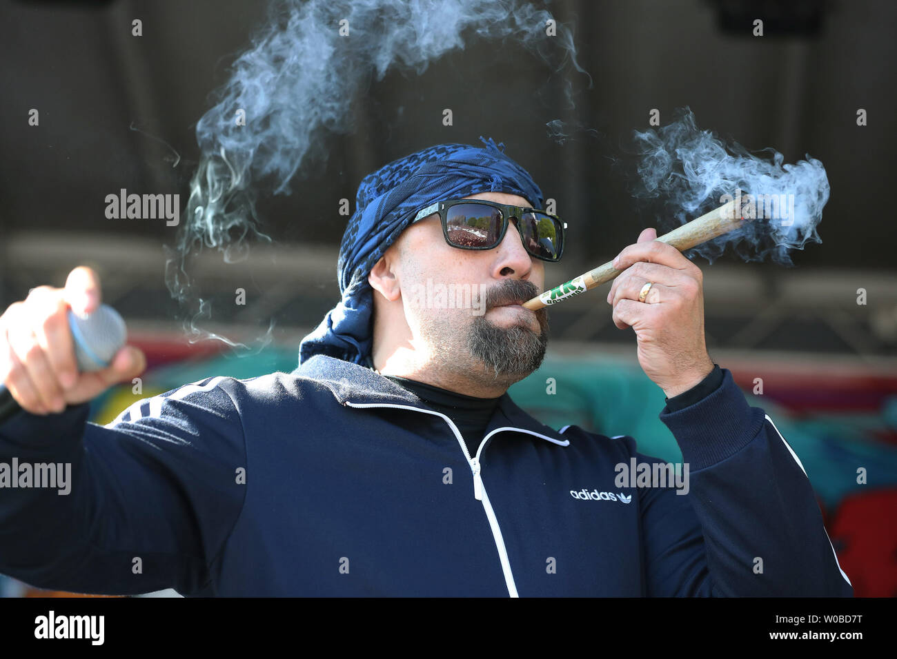 Louis "B-Real" Freese, of the Latino-American hip hop band Cypress Hill  smokes a joint onstage while performing during the controversial 25th  annual 4/20 protest at Sunset Beach in Vancouver, British Columbia on