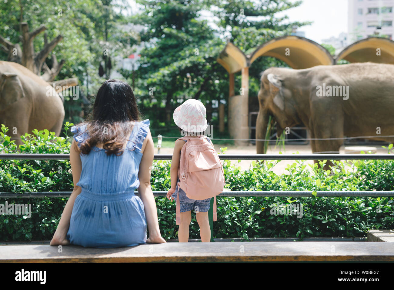 Mother watching daughter zoo hires stock photography and images Alamy