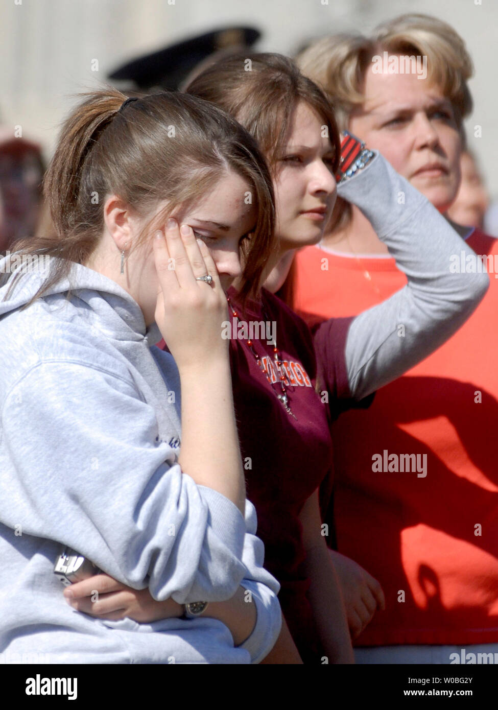 A students wipe tears from her face during a silent vigil to honor the 32 victims of last Mondays shooting, on the campus of Virginia Tech in Blacksburg, Virginia on April 23, 2007. Cho Seung-Hui, a student at Virginia Tech, went on a shooting spree and killed 32 people on April 16, 2007. Today was the first day of classes since the shooting. (UPI Photo/Kevin Dietsch) Stock Photo