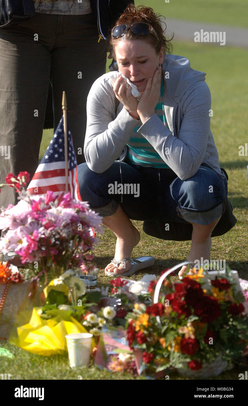 A mourner visits a memorial for the 32 victims of last Mondays shooting, on the campus of Virginia Tech in Blacksburg, Virginia on April 23, 2007. Cho Seung-Hui, a student at Virginia Tech, went on a shooting spree and killed 32 people on April 16, 2007. Today was the first day of classes since the shooting. (UPI Photo/Kevin Dietsch) Stock Photo
