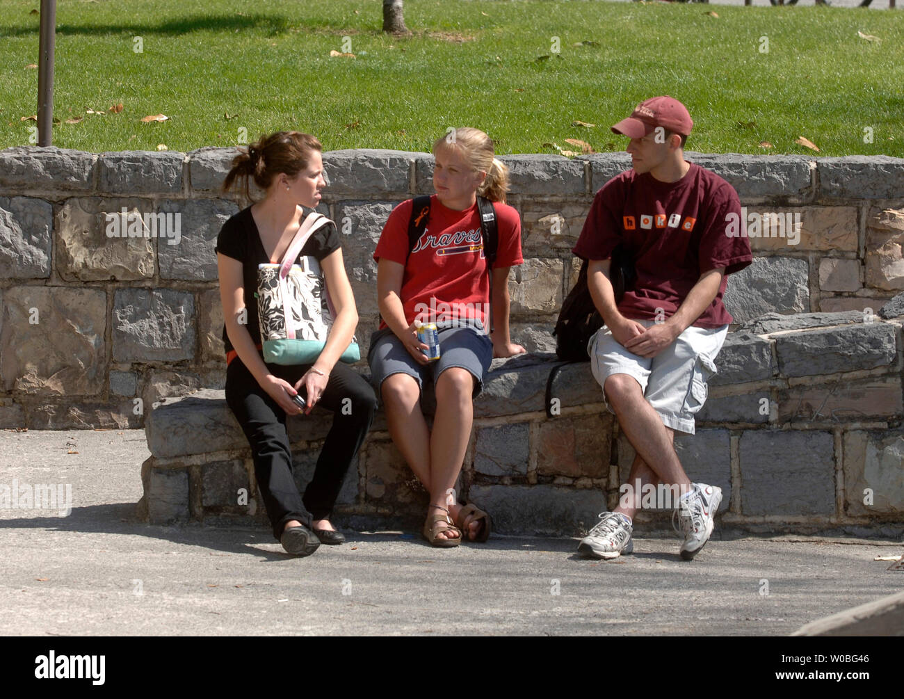Virginia Tech students sit on a bench on the first day of classes since, Cho Seung-Hui, a student at Virginia Tech, went on a shooting spree and killed 32, on the campus of Virginia Tech in Blacksburg, Virginia on April 23, 2007. (UPI Photo/Kevin Dietsch) Stock Photo