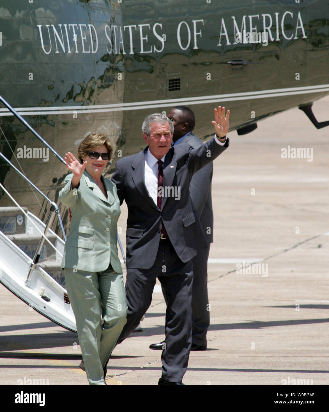 President George W. Bush and First Lady Laura Bush arrive on Marine One and disembark at TSTC airport in Waco, Texas from their ranch in Crawford, Texas June 18, 2006. The President and First Lady spent the Father's Day weekend at his ranch in Crawford, Texas.  (UPI Photo/Ron Russek II) Stock Photo