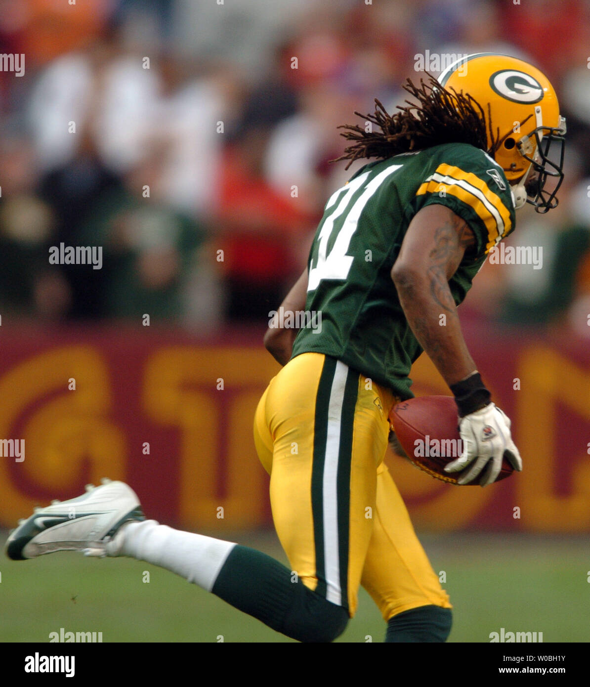 Green Bay Packer cornerback. Al Harris intercepts a Mark Brunell pass late  in the fourth quarter as the Green Bay Packers defeated the Washington  Redskins 28-14 on Sunday October 31, 2004 at