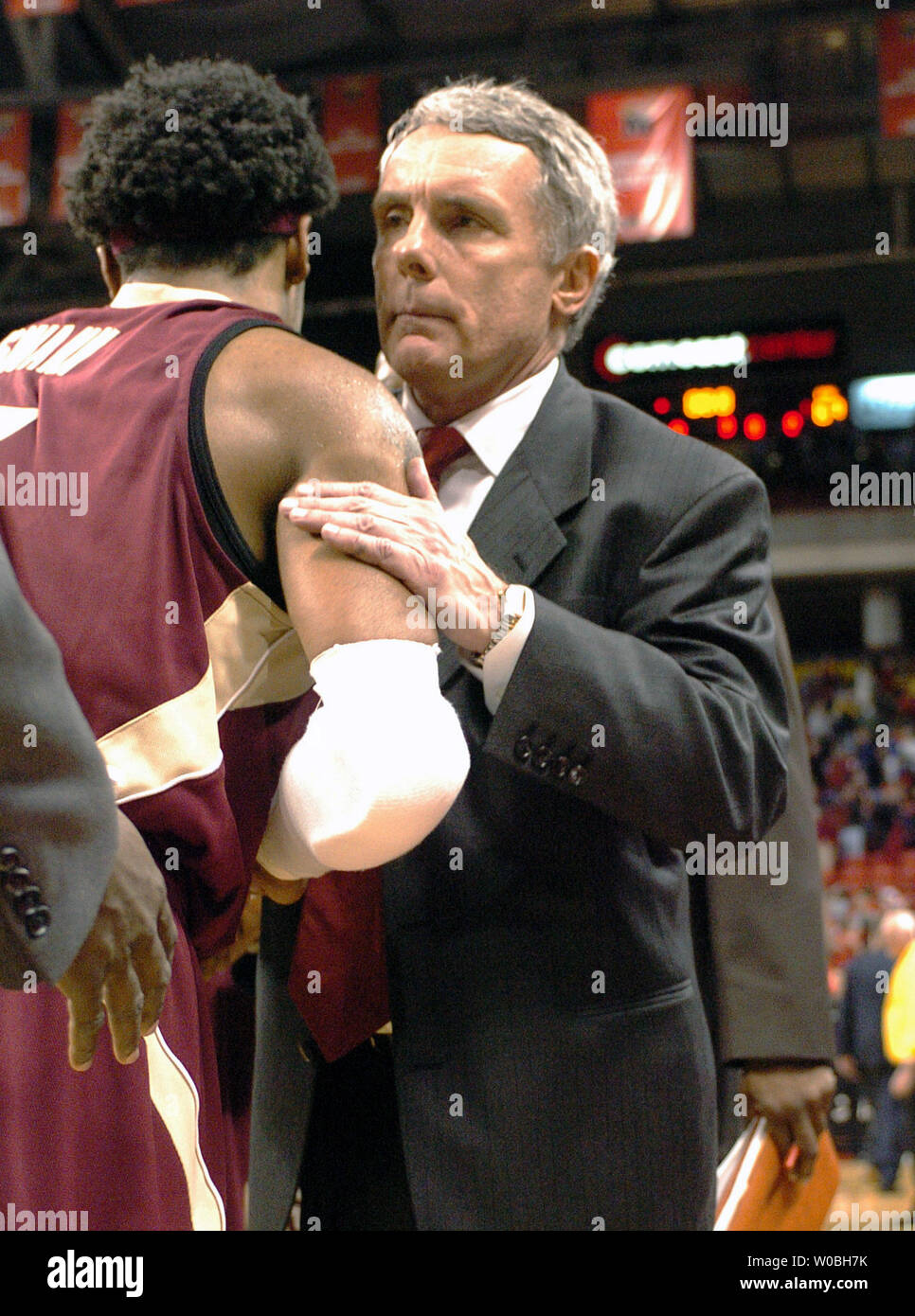 Head Coach Gary Williams of the University of Maryland consoles Isiah Swann after the Terrapins 90-88 overtime victory over the Florida State Seminoles on December 19, 2004 at the Comcast Center in  College Park, MD. (UPI Photo/Mark Goldman) Stock Photo