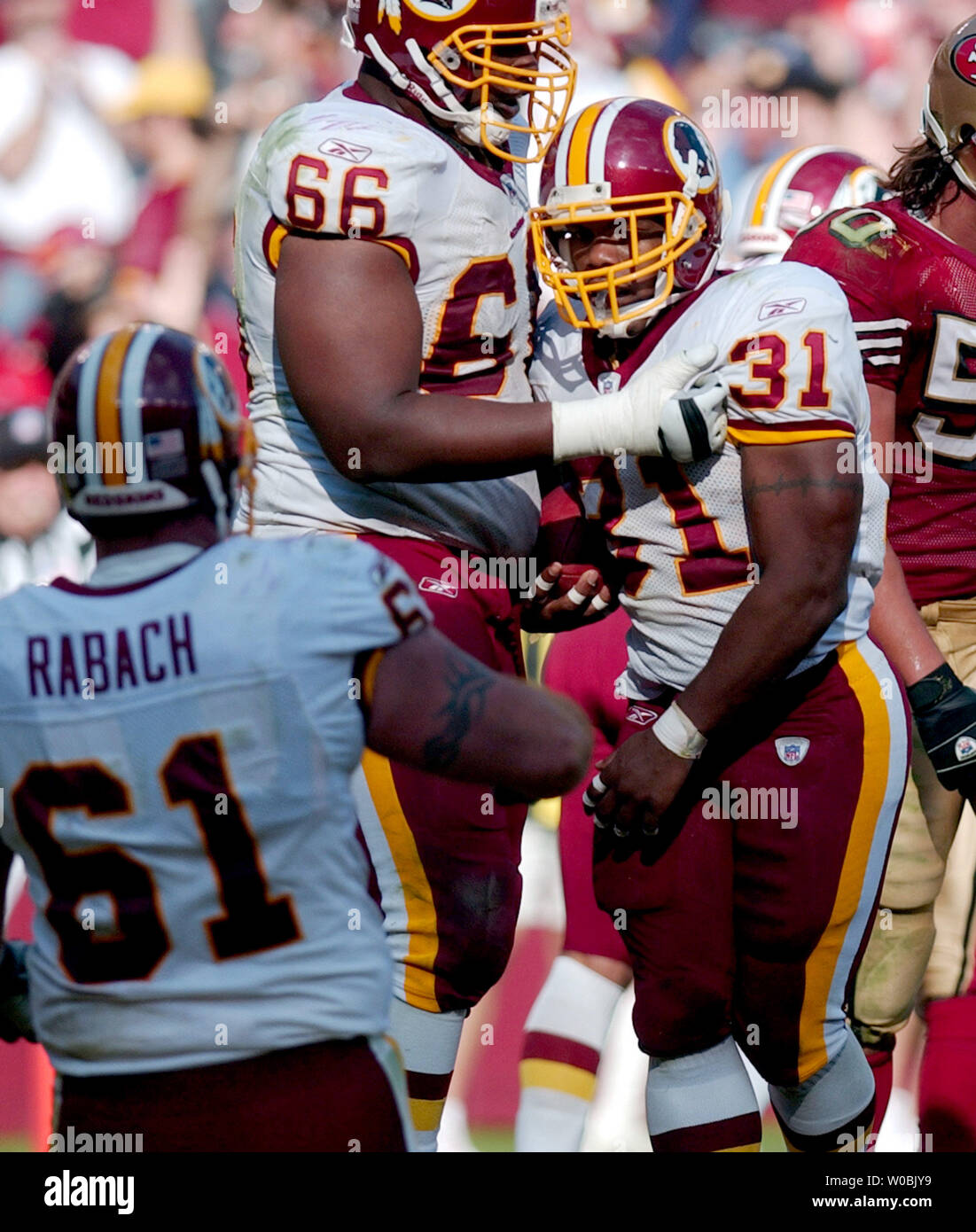 Washington Redskins Rock Cartwright (31) is tackled by New York Giants  Gerris Wilkinson (59) during their game played at FedEx Field in Landover,  Maryland, Sunday, November 30, 2008. (Photo by Harry E.