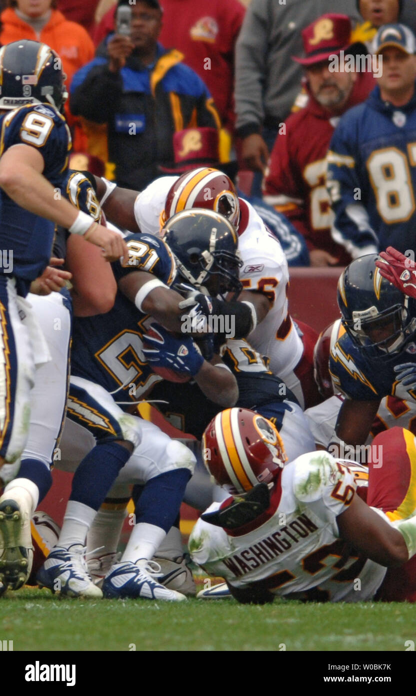 Chris Cooley of the Washington Redskins makes a fourth quarter reception  and touchdown against Kim Herring of the Cincinnati Bengals who defeated  the Redskins 17-10 on November 14, 2004 at Fed Ex