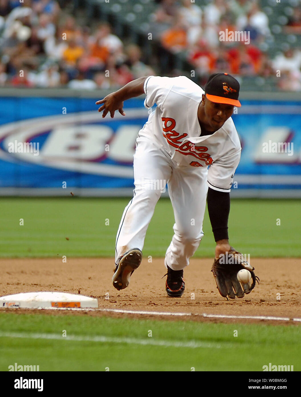The Baltimore Orioles Melvin Mora (6) fields a slow roller in the fifth