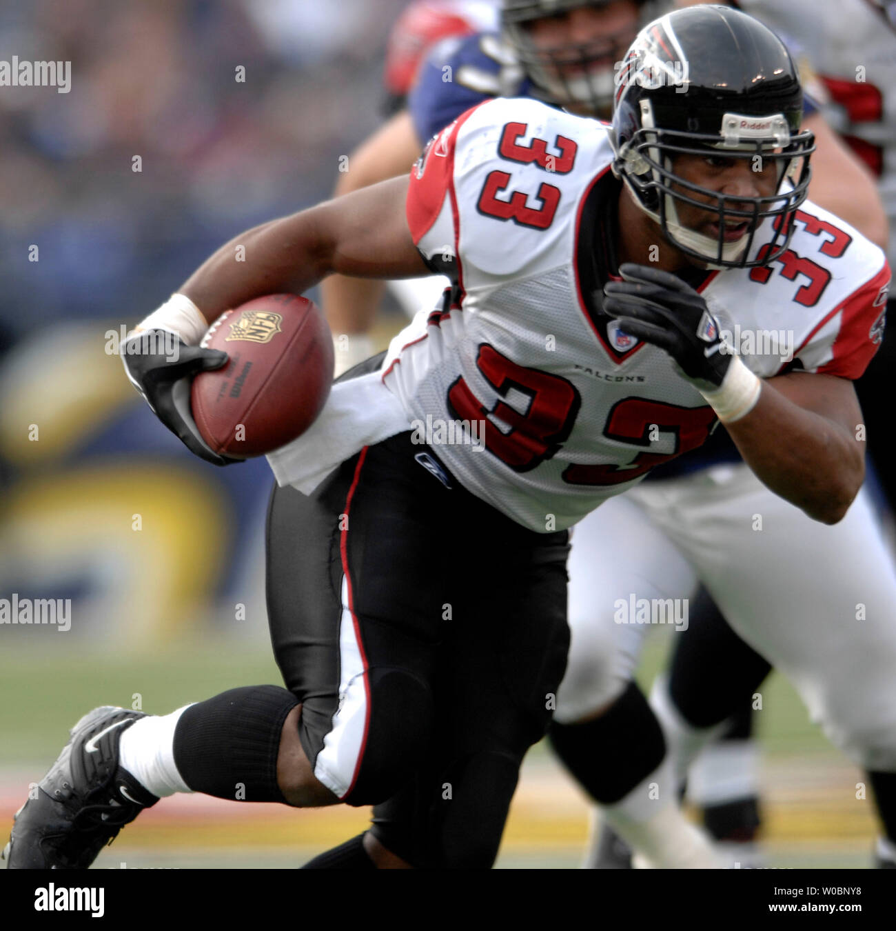 Atlanta Falcons running back Justin Griffith rushes in first half action  against the Miami Dolphins at Dolphin Stadium, this play ended in a fumble  which the Dolphinss recovered, in Miami Florida, on