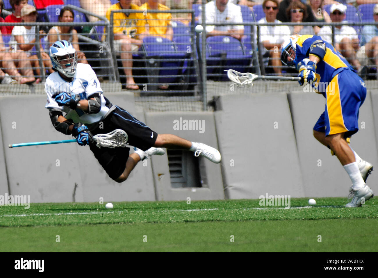 The Johns Hopkins University Blue Jays Josh Peck (L) is knocked out of bounds in the first quarter by Delaware Blue Hens Brett Manney in the semi-final of the NCAA Division I lacrosse championship at M&T Bank Stadium in Baltimore, Maryland on May 26, 2007.  (UPI Photo/ Mark Goldman) Stock Photo