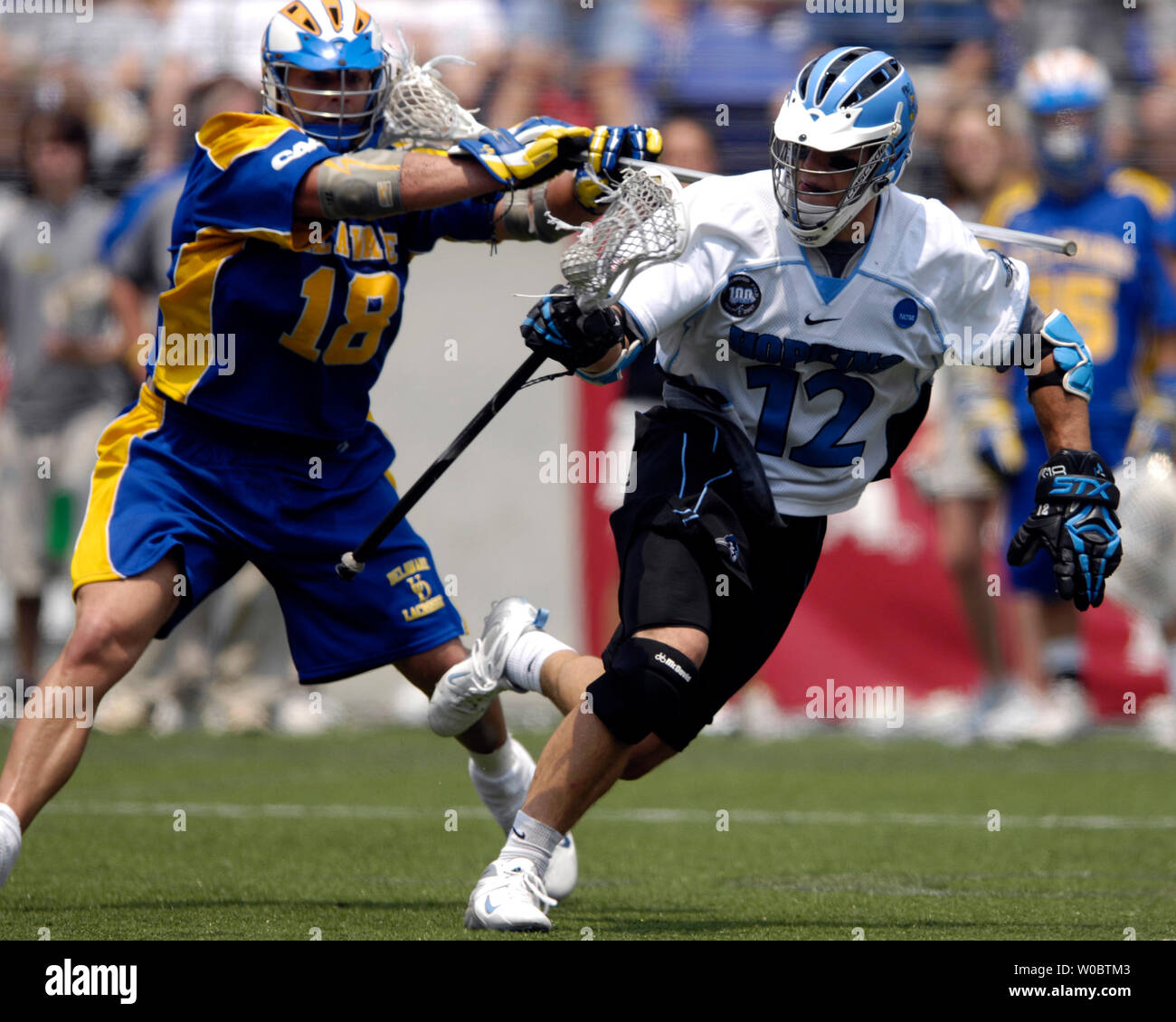 Johns Hopkins University Blue Jays Stephen Peyser (12) works to the net in the third quarter against Delaware Blue Hens Rob Smith (18) in the semi-final of the NCAA Division I lacrosse championship at M&T Bank Stadium in Baltimore, Maryland on May 26, 2007.   Johns Hopkins defeated Delaware 8-3 to move to the lacrosse championship.   (UPI Photo/ Mark Goldman) Stock Photo