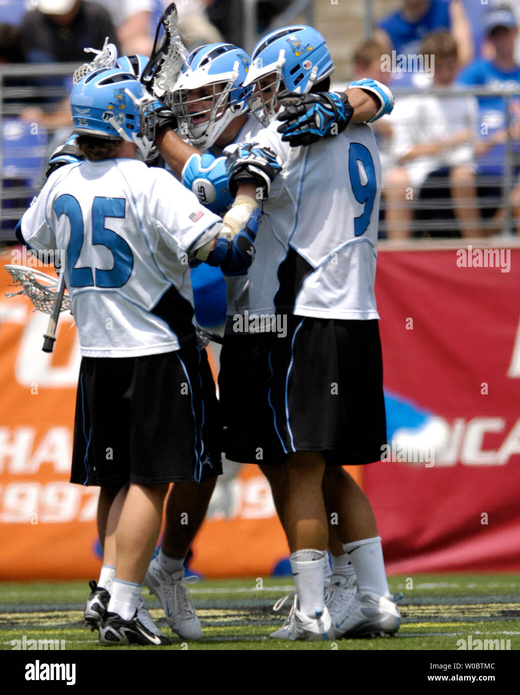 Johns Hopkins University Blue Jays Stephen Peyser (c) is congratulated by Jake Byrne (25) and Paul Rabil (9) after scoring a goal in the fourth quarter against the Delaware Blue Hens in the semi-final of the NCAA Division I lacrosse championship at M&T Bank Stadium in Baltimore, Maryland on May 26, 2007.   Johns Hopkins defeated Delaware 8-3 to move to the lacrosse championship.   (UPI Photo/ Mark Goldman) Stock Photo