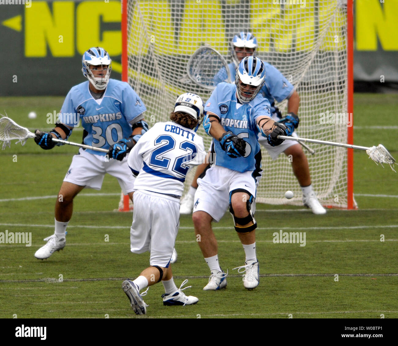 Duke University mid fielder Ned Crotty (22) shoots and scores in the second quarter against Johns Hopkins defenseman Eric Zerrlaut (16) in the NCAA Division I Championship of the lacrosse championship at M&T Bank Stadium in Baltimore, Maryland on on May 28, 2007.  (UPI Photo/ Mark Goldman) Stock Photo