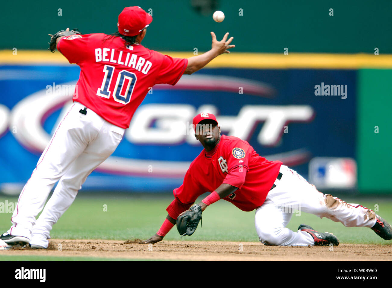 Washington Nationals shortstop Cristian Guzman (R) tosses the ball to second baseman Ronnie Belliard (10) to force out designated hitter Travis Hafner in the second inning on June 24, 2007 at RFK Stadium in Washington.  The Nationals defeated the Indians 3-1.  (UPI Photo/Mark Goldman) Stock Photo