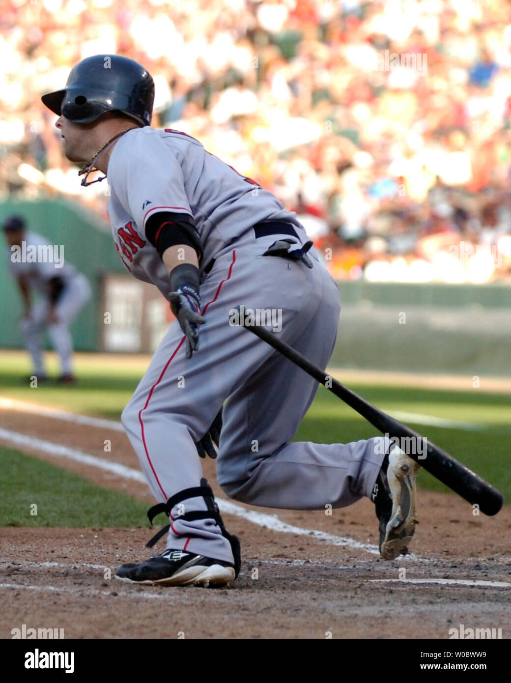 Boston Red Sox second baseman Dustin Pedroia hits an RBI single scoring  catcher Jason Varitek against Orioles pitcher Paul Shuey with the bases  loaded in the eighth inning at Camden Yards in