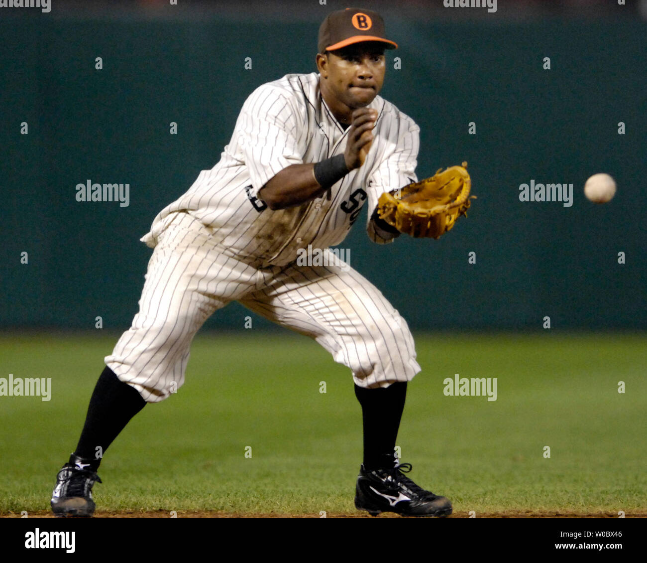 Baltimore Orioles shortstop Miguel Tejada fields a ground ball in the fifth  inning hit by Boston Red Sox third baseman Mike Lowell at Orioles Park at Camden  Yards in Baltimore on September