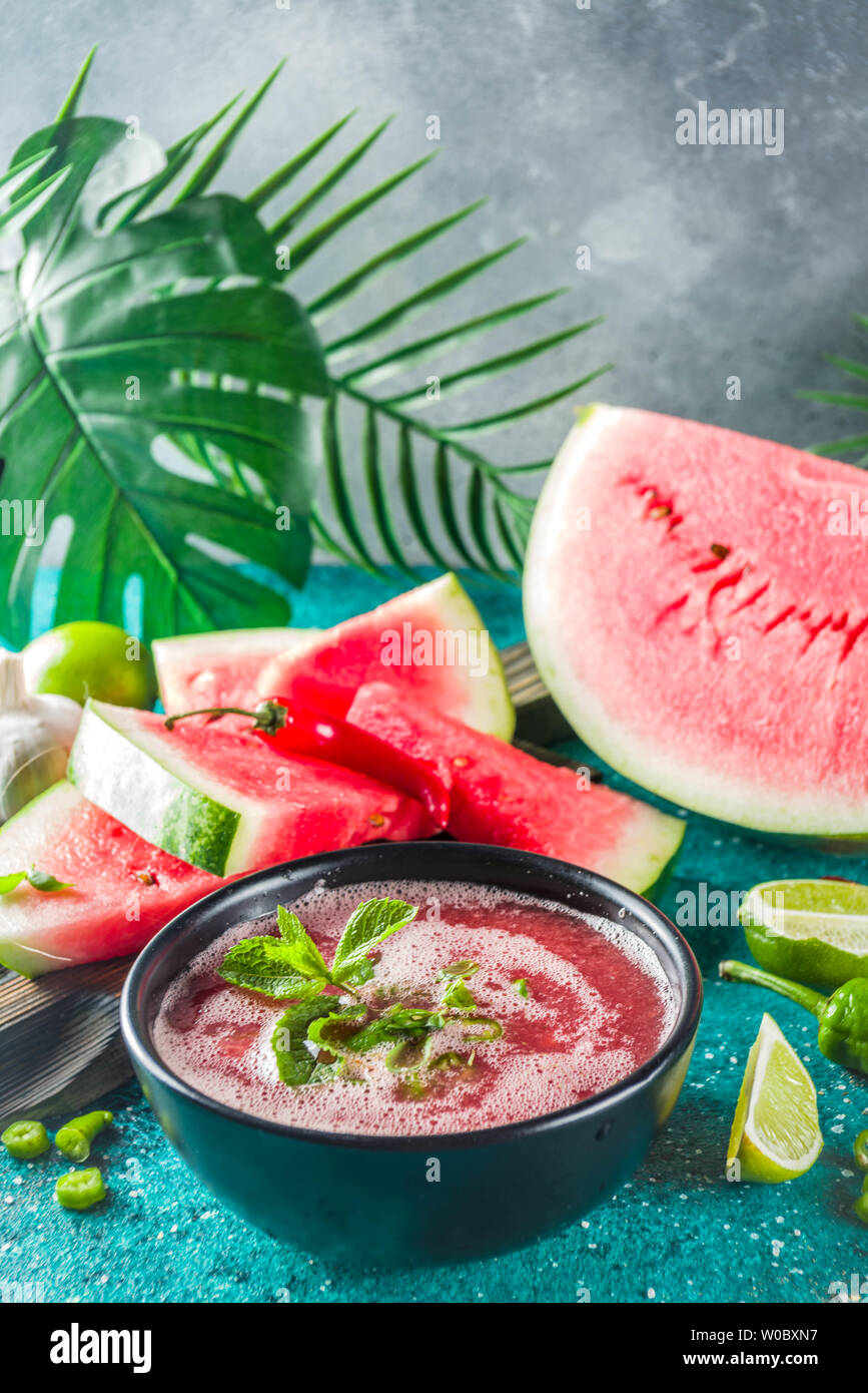 Summer cold watermelon smoothie gazpacho soup, marine blue background ...