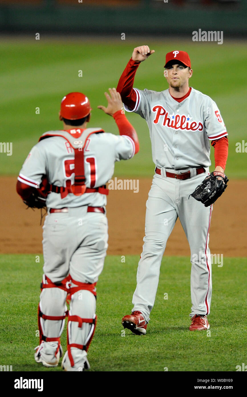 Philadelphia Phillies relief pitcher Brad Lidge (R) is congratulated by  catcher Carlos Ruiz (51) after pitching the 9th inning for his 11th save of  the year against the Washington Nationals on May