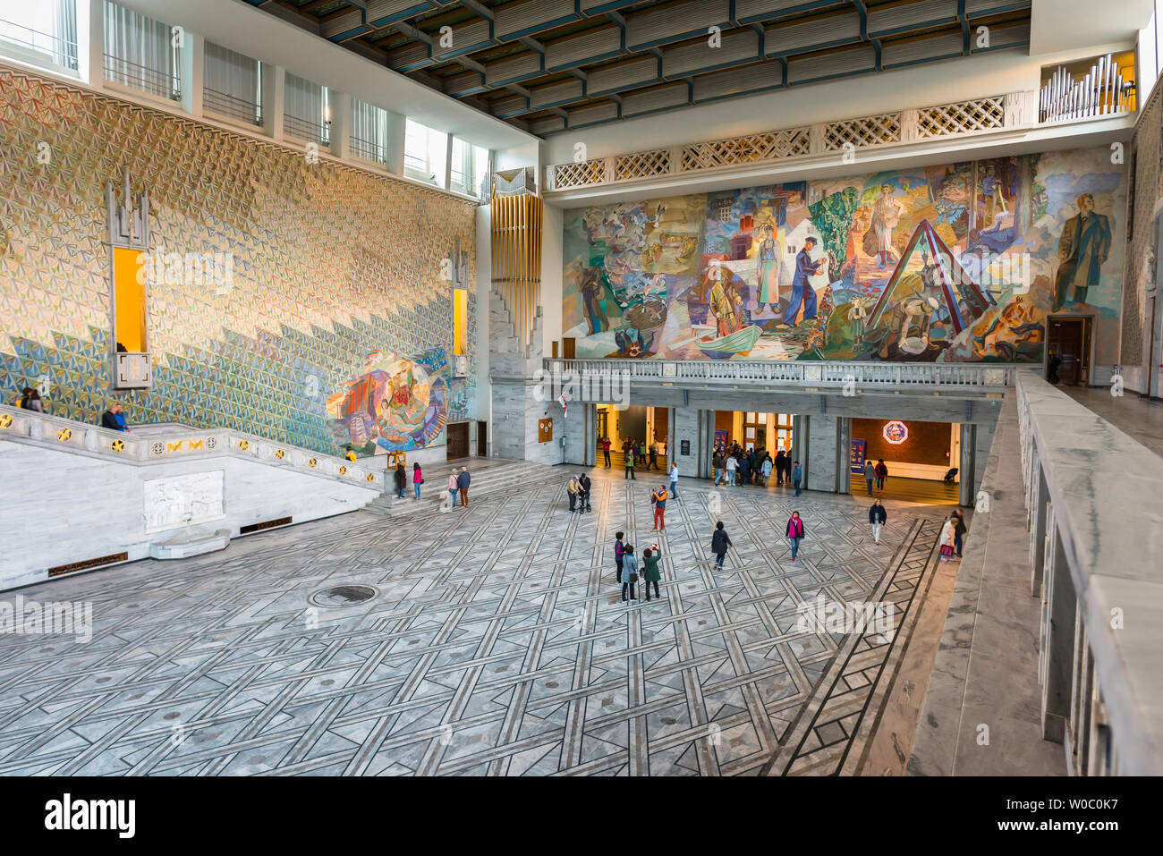 Oslo City Hall, view of the Great Hall inside the Oslo City Hall (Radhus) with a huge fresco celebrating Norwegian working life by Alf Rolfsen visible. Stock Photo