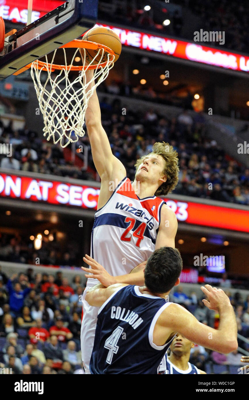 Washington Wizards small forward Jan Vesely (24) scores on a dunk against  Oklahoma City Thunder power forward Nick Collison (4) in the first half at  the Verizon Center in Washington, D.C. on