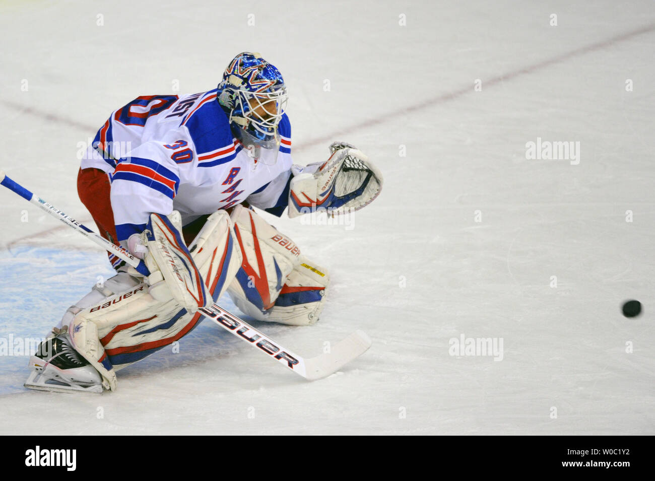 New York Rangers goalie Henrik Lundqvist (30) makes a save against the ...