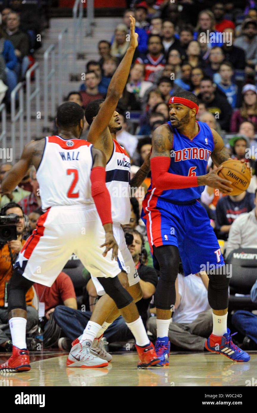 Detroit Pistons small forward Josh Smith (6) works the ball against Washington Wizards small forward Trevor Ariza (1) and point guard John Wall (2) in the first half at the Verizon Center in Washington, D.C. on December 28, 2013.   UPI/Mark Goldman Stock Photo