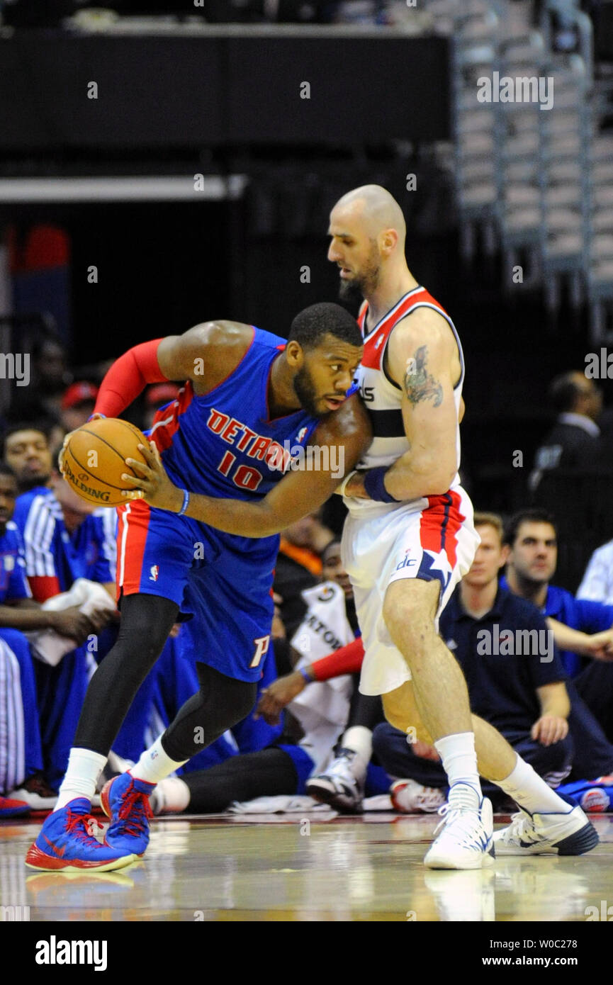 Detroit Pistons power forward Greg Monroe (10) works the ball against Washington Wizards center Marcin Gortat (4) in the first half at the Verizon Center in Washington, D.C. on January 18, 2014.   UPI/Mark Goldman Stock Photo