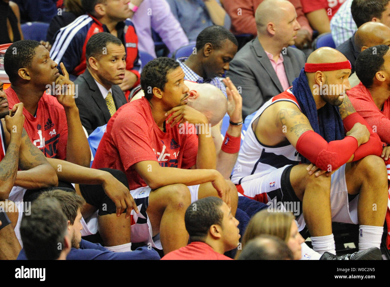 The Washington Wizards bench (L-R), center Kevin Seraphin (13), guard Andre  Miller (24), center Marcin Gortat (4), and forward Drew Gooden (90) sit on  the bench as time winds down in the