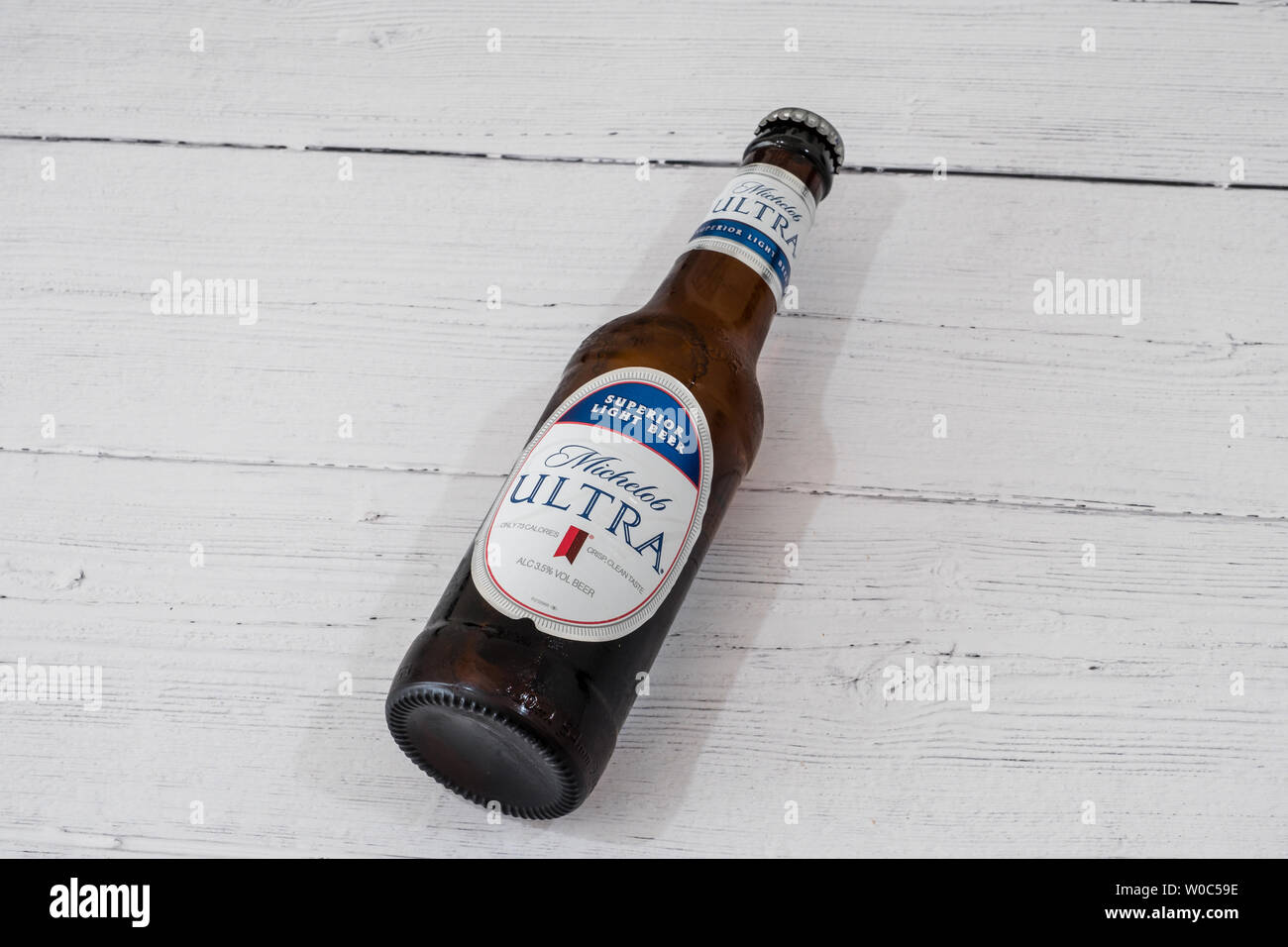 Largs, Scotland, UK - June 20, 2019: A Bottle of Michelob Ultra branded Lager Beer in recyclable glass bottle in line with current UK initiatives Stock Photo