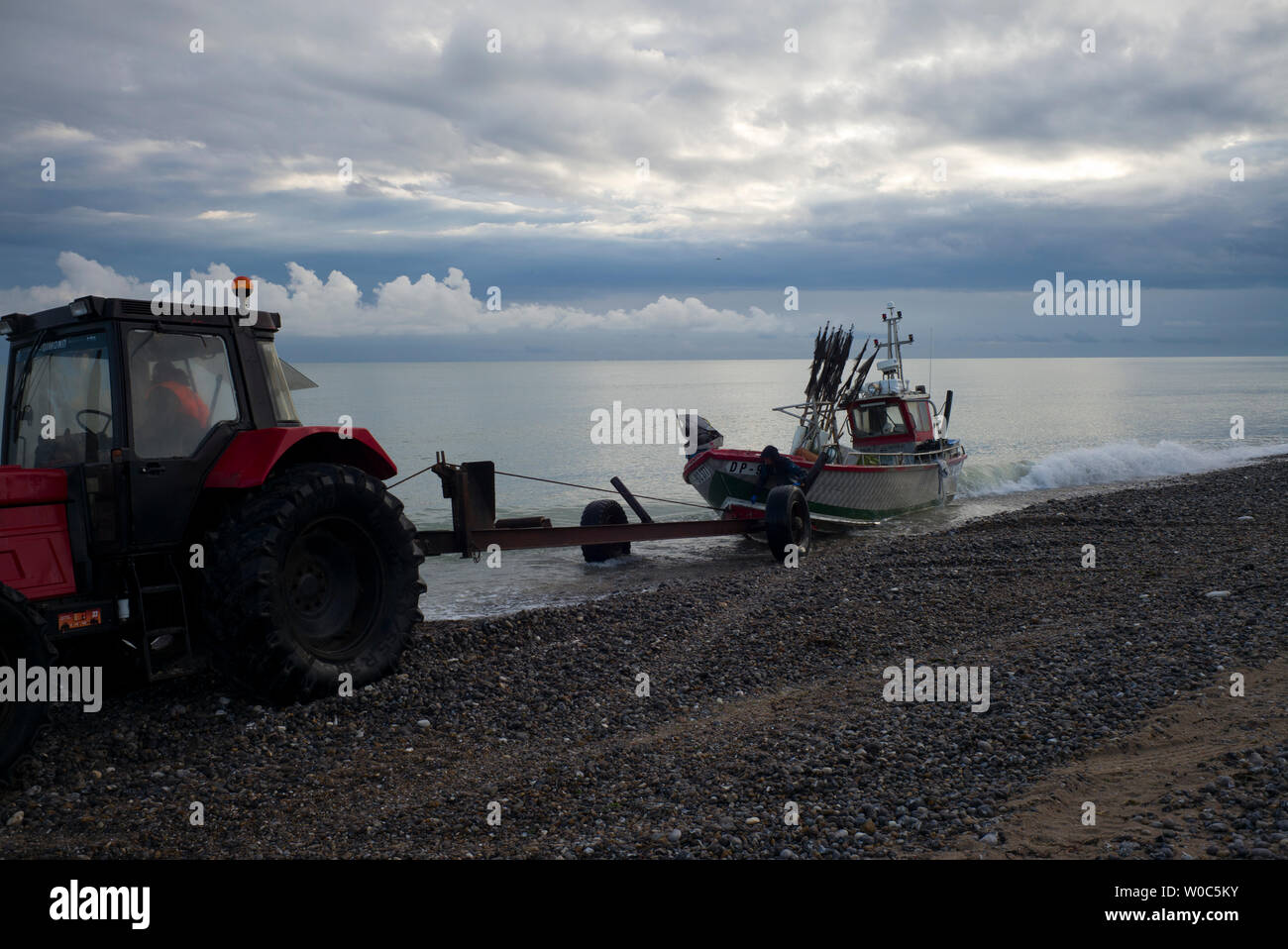 Fishing boat landing, Normandy, France Stock Photo
