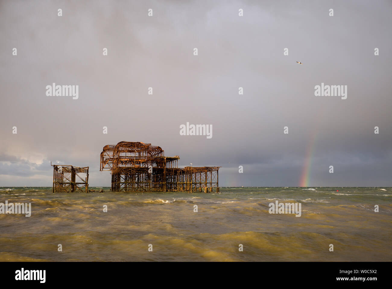 Abandoned West Pier, Brighton with rainbow Stock Photo