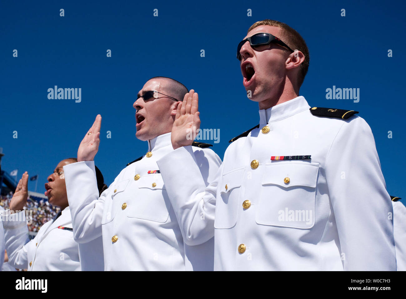 Midshipmen take their oath of office at the United States Naval Academy during Graduation and Commissioning Ceremonies for the Class of 2008 in Annapolis, Maryland on May 23, 2008. (UPI Photo/Patrick D. McDermott) Stock Photo