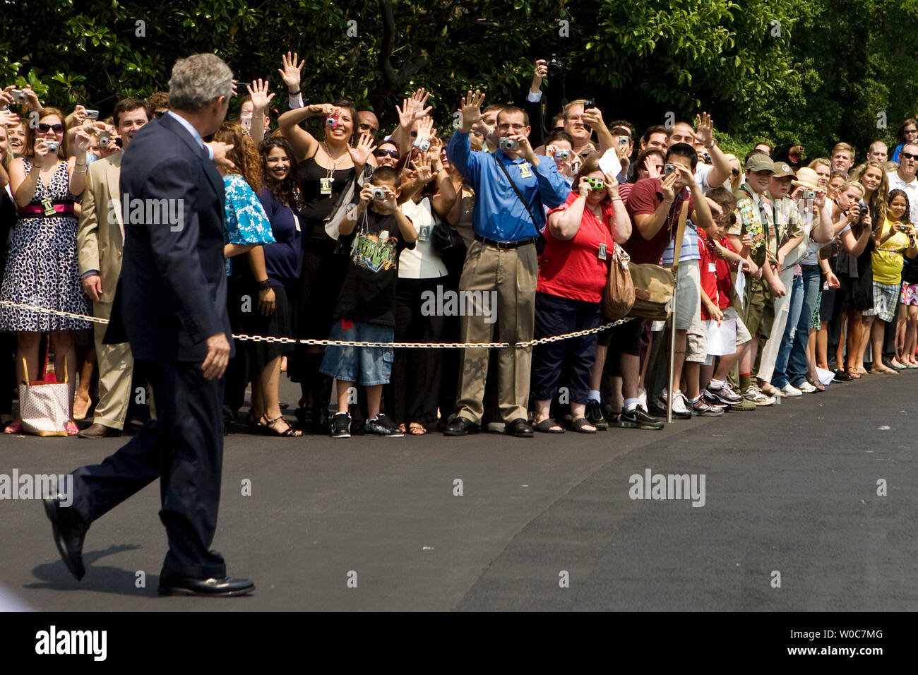 U.S. President George W. Bush waves to members of the public as he departs from the White House in Washington on June 6, 2008. President Bush is going to Camp David for the weekend. (UPI Photo/Patrick D. McDermott) Stock Photo