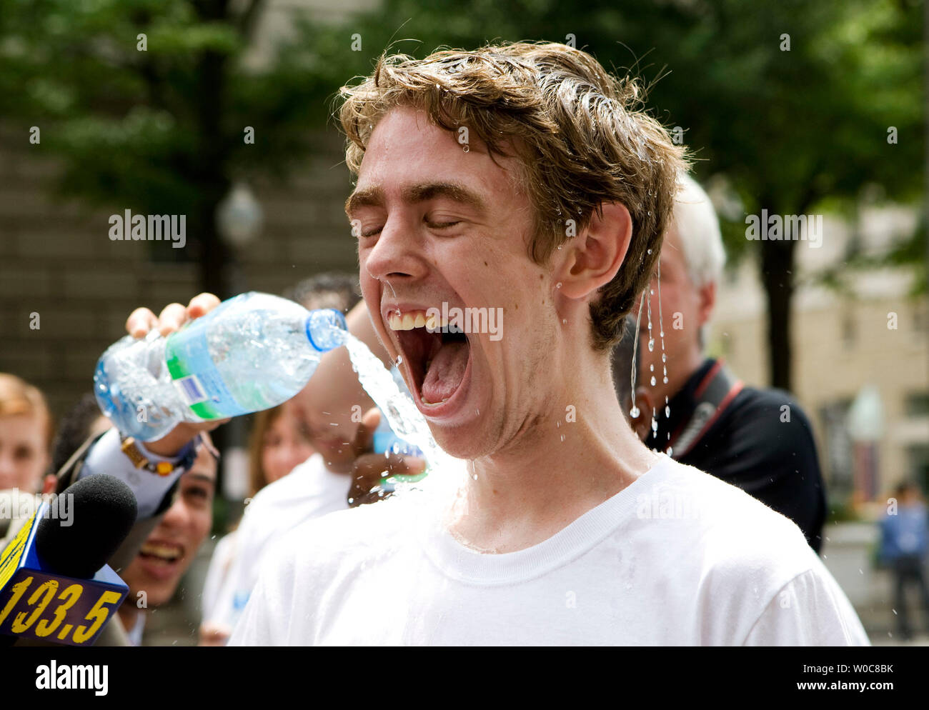 https://c8.alamy.com/comp/W0C8BK/macs-smith-a-waiter-at-brasserie-les-halles-reacts-as-his-coworkers-celebrate-his-win-by-pouring-water-on-him-after-the-34th-annual-waiter-and-waitress-race-held-by-the-brasserie-les-halles-celebrating-bastille-day-in-washington-on-july-14-2008-the-object-of-the-race-is-to-complete-the-three-lap-course-the-fastest-while-carrying-a-tray-balancing-a-bottle-of-volvic-and-a-half-filled-glass-of-volvic-without-spilling-upi-photopatrick-d-mcdermott-W0C8BK.jpg