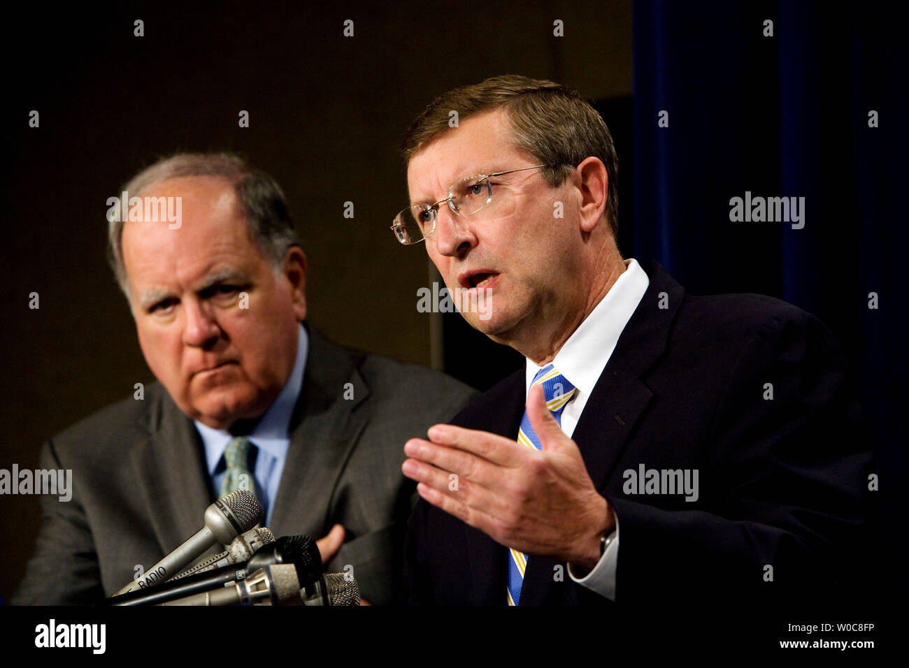 House Budget Chairman John Spratt, D-SC, (L) looks on as Senate Budget Chairman Kent Conrad, D-ND, speaks during a news conference to discuss the new deficit projections in the Office of Management and Budget's fiscal year 2009 mid-year review on Capitol Hill in Washington on July 28, 2008. The federal deficit is projected to be $482 billion for 2009. (UPI Photo/Patrick D. McDermott) Stock Photo