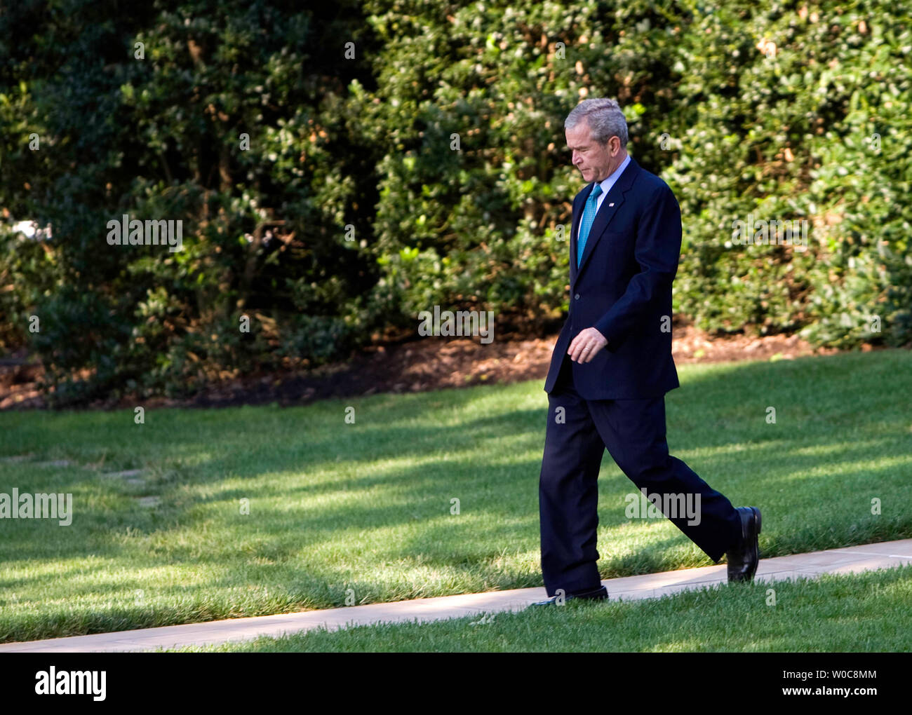 U.S. President George W. Bush walks across the South Lawn of the White House towards Marine One in Washington on August 15, 2008. President Bush is traveling to his ranch in Crawford, Texas. (UPI Photo/Patrick D. McDermott) Stock Photo