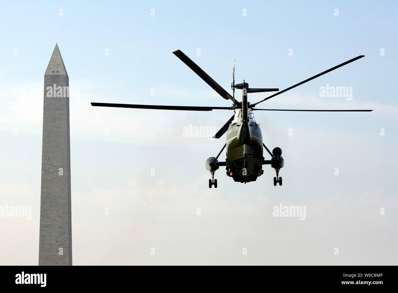 Marine One, carrying U.S. President George W. Bush, flies by the Washington Monument in Washington on August 15, 2008. President Bush is traveling to his ranch in Crawford, Texas. (UPI Photo/Patrick D. McDermott) Stock Photo