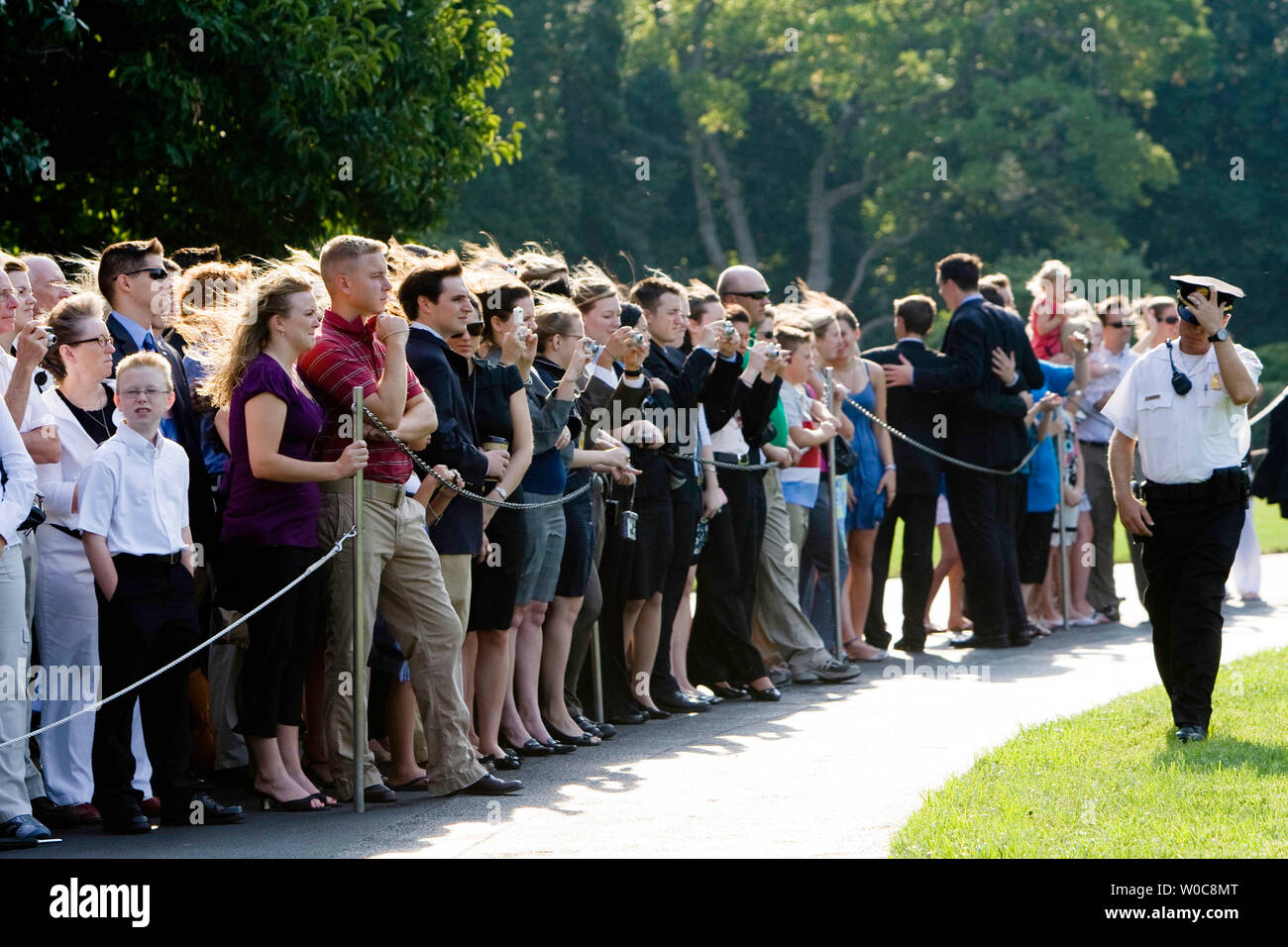 Members of the public watch as Marine One, carrying U.S. President George W. Bush, takes off from the South Lawn of the White House in Washington on August 15, 2008. President Bush is traveling to his ranch in Crawford, Texas. (UPI Photo/Patrick D. McDermott) Stock Photo