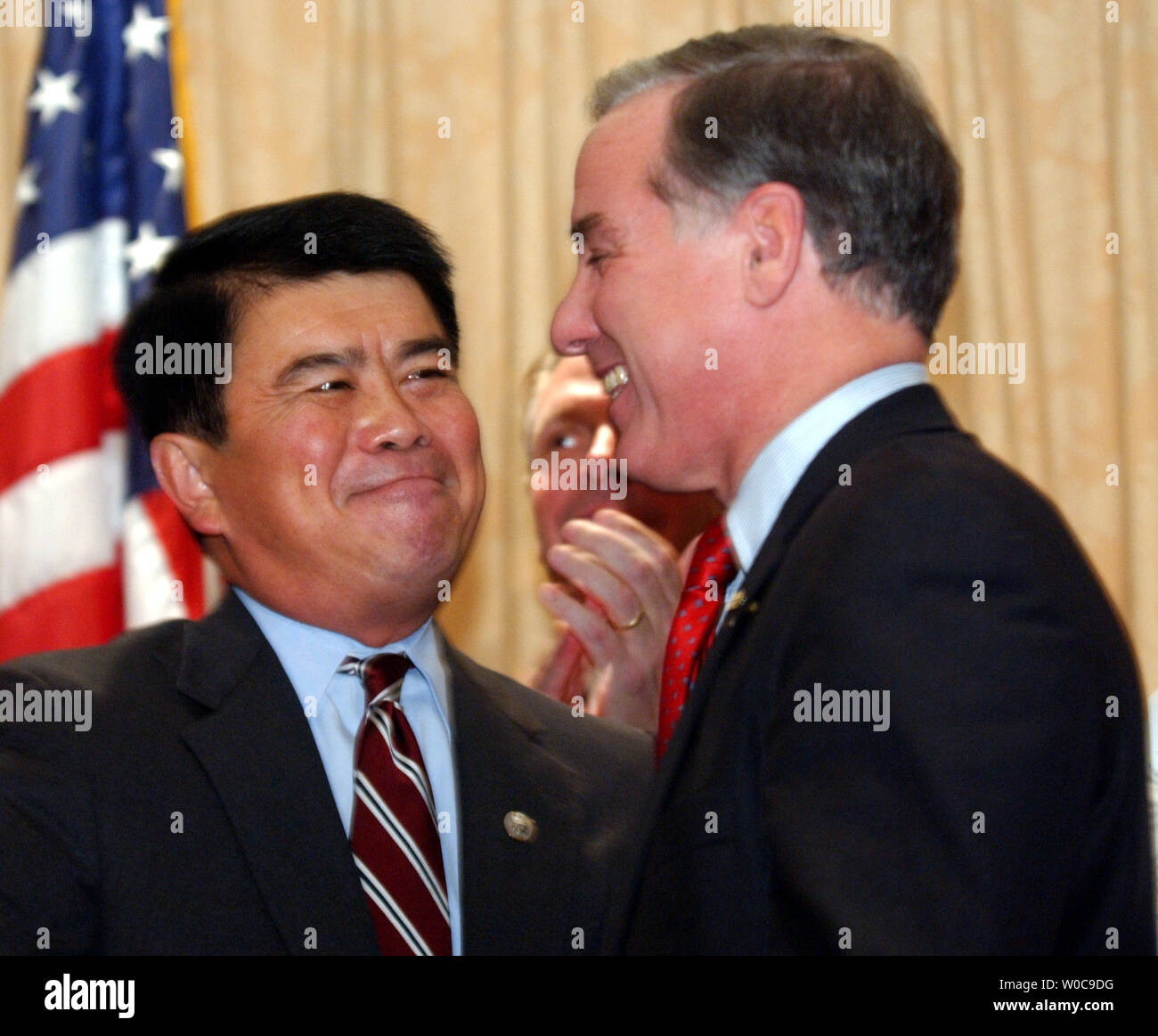 Presidential hopeful Howard Dean shares a moment with Congressman David Wu, D-OR, during an Asian American Action Fund event on November 17, 2003 in Washington.  Dean was supprised by the sudden and unexpected indorcement from Wu.   (UPI Photo/Michael Kleinfeld) Stock Photo