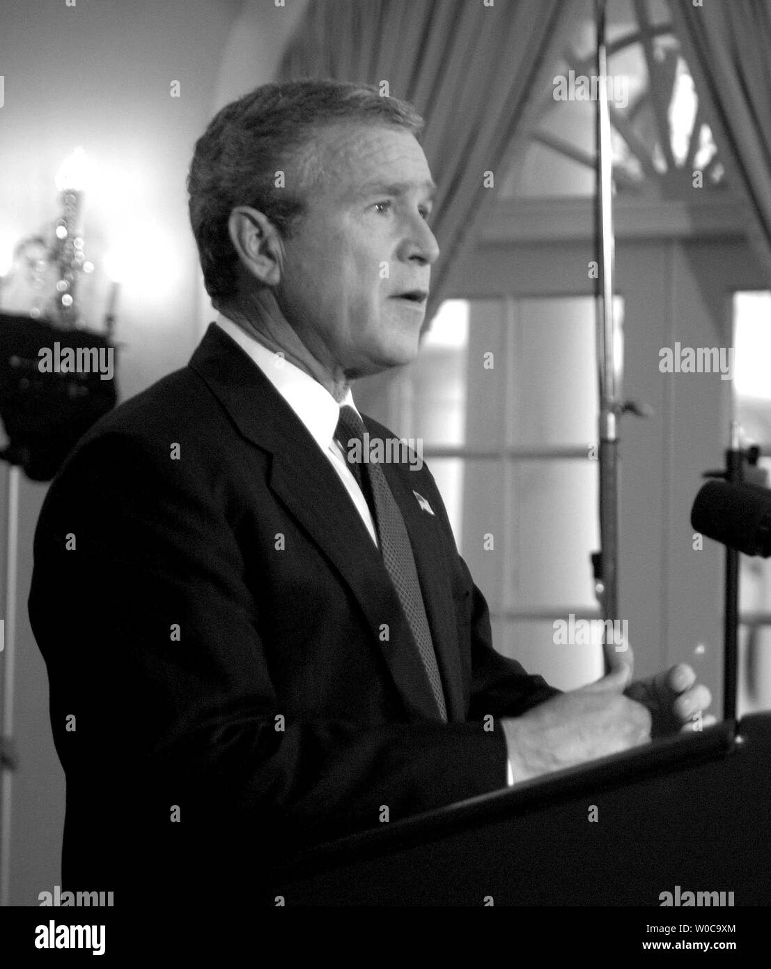 President George W. Bush addresses the nation from the White House to let the American people know that Saddam Hussein has been captured by the U.S. military, on December 14, 2003 in Washington.   The ex-Iraqi leader was hiding out near the town of Tikrit when he was captured.     (UPI Photo/Michael Kleinfeld) Stock Photo