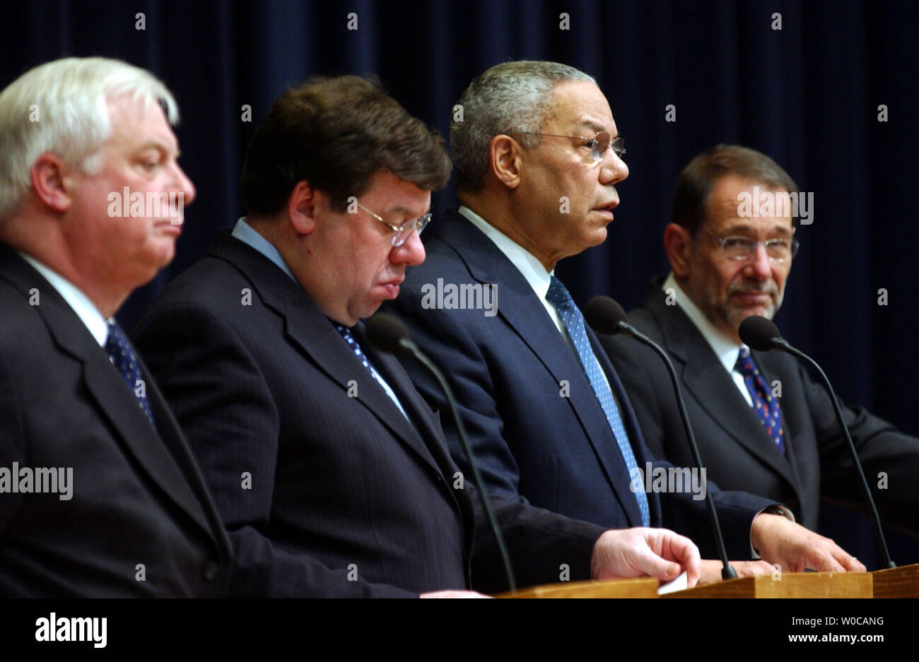 (L to R) EU External Affairs Commissioner Christopher Patten, EU President Brian Cowen and EU Secretary General Javier Solana look on as U.S. Secretary of State Colin Powell answers questions during a news conference at the State Dept. in Washington, March 1, 2004. The four met earlier in the day and said that topics of discussion included the situation in Haiti and trade between the U.S. and European Union members. Stock Photo