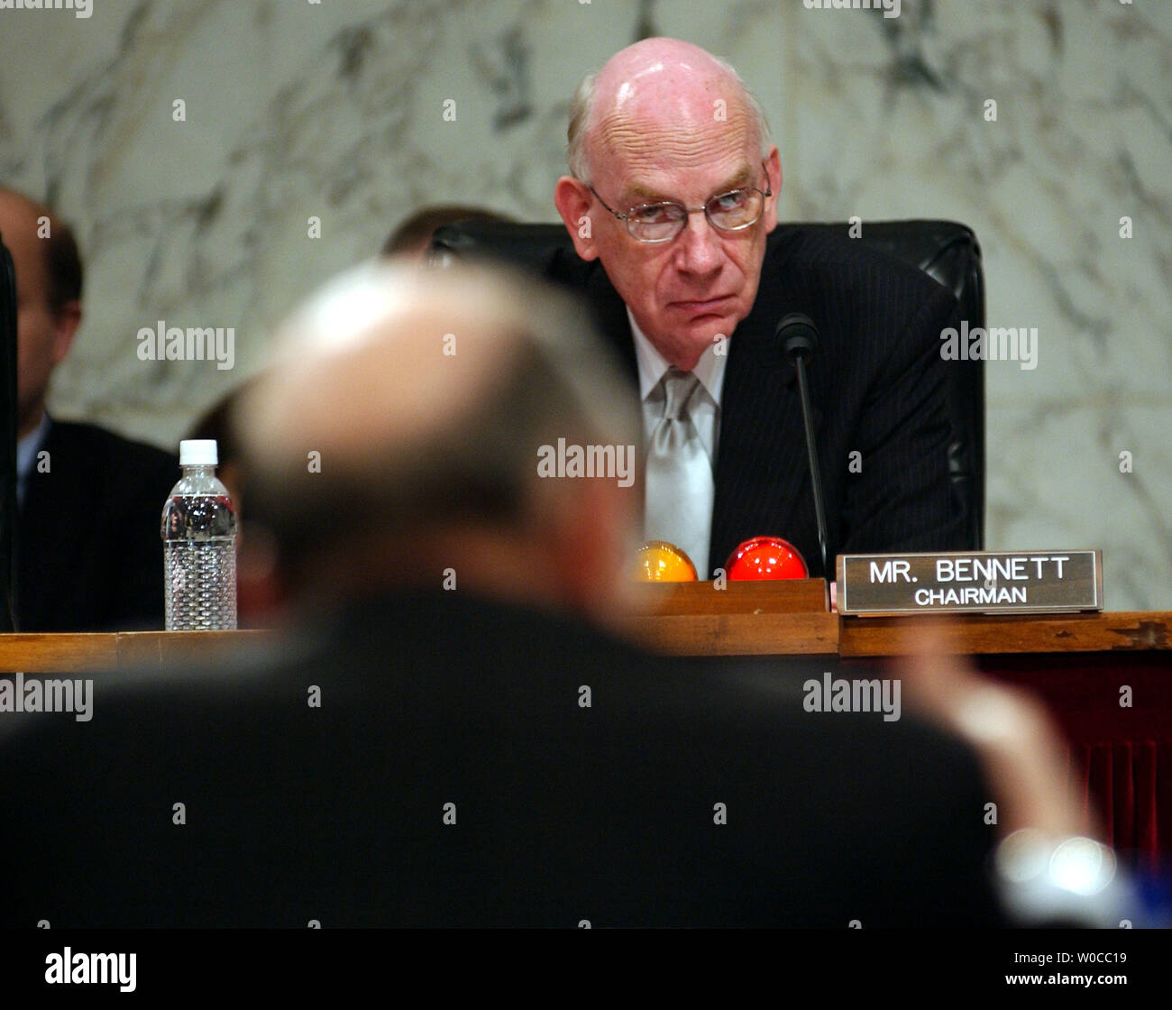 Chairman Robert Bennett, R-Utah, listens to tesitmony by Chairman of the Federal Reserve System Alan Greenspan before the Joint Economic Committee on April 21, 2004 in Washington. (UPI Photo/Michael Kleinfeld) Stock Photo