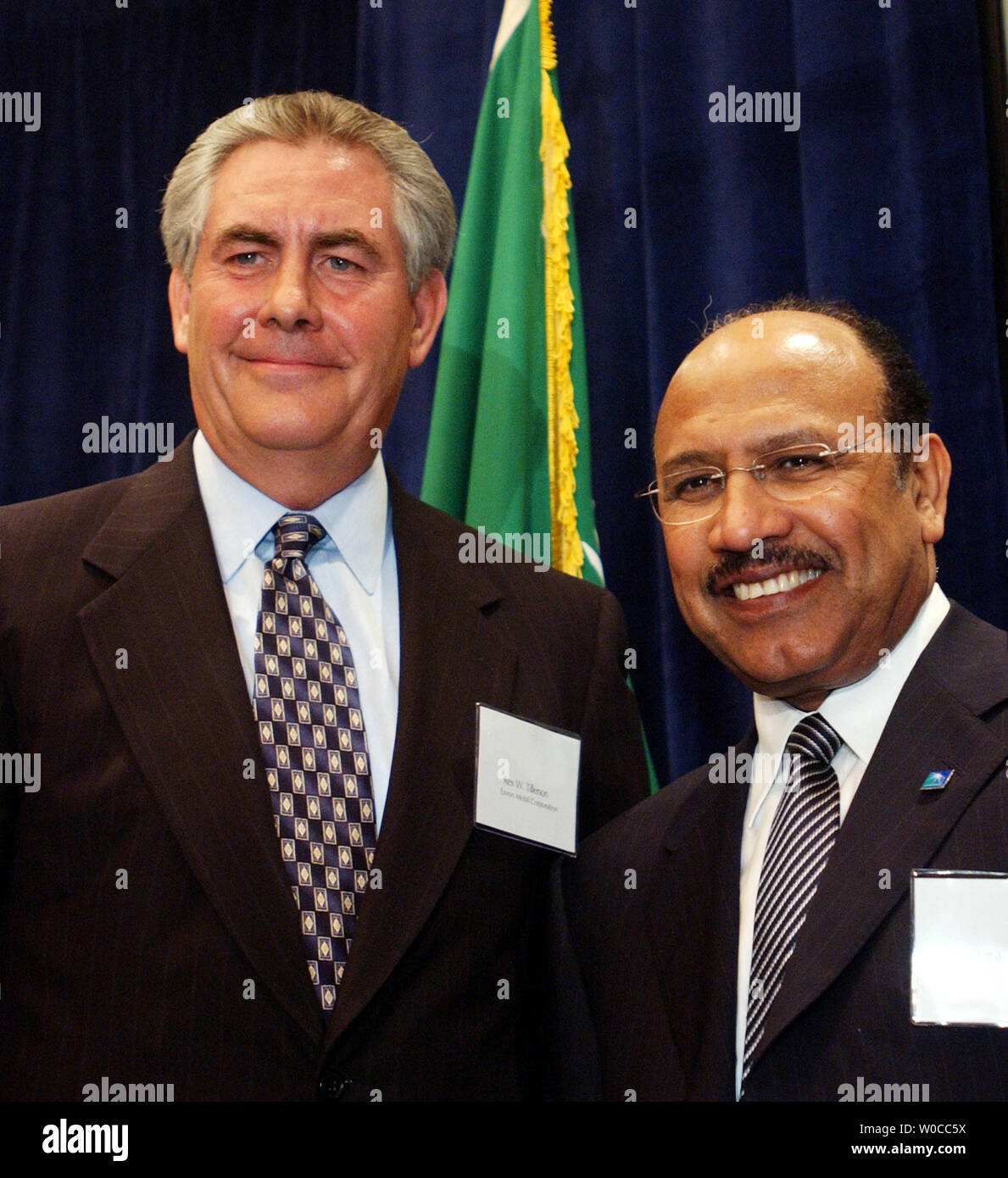 Abdallah Jum'ah, CEO of Saudi Aramco has a laugh with Rex Tillerson, President of Exxon Mobil, left, during a conference on the United States and Saudi Arabia relationship and their interests in energy security, on April 27, 2004 in Washington.  The conference was sponsored by CSIS and dealt with oil reserves, production, prices and security. (UPI Photo/Michael Kleinfeld) Stock Photo