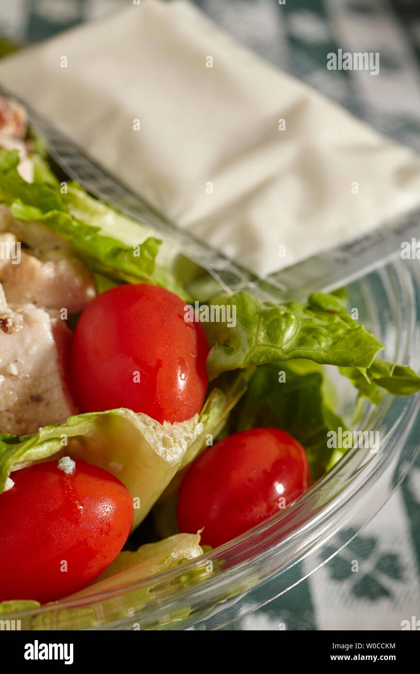 Pre-made salad in a plastic container. A staple food of the modern world. Stock Photo