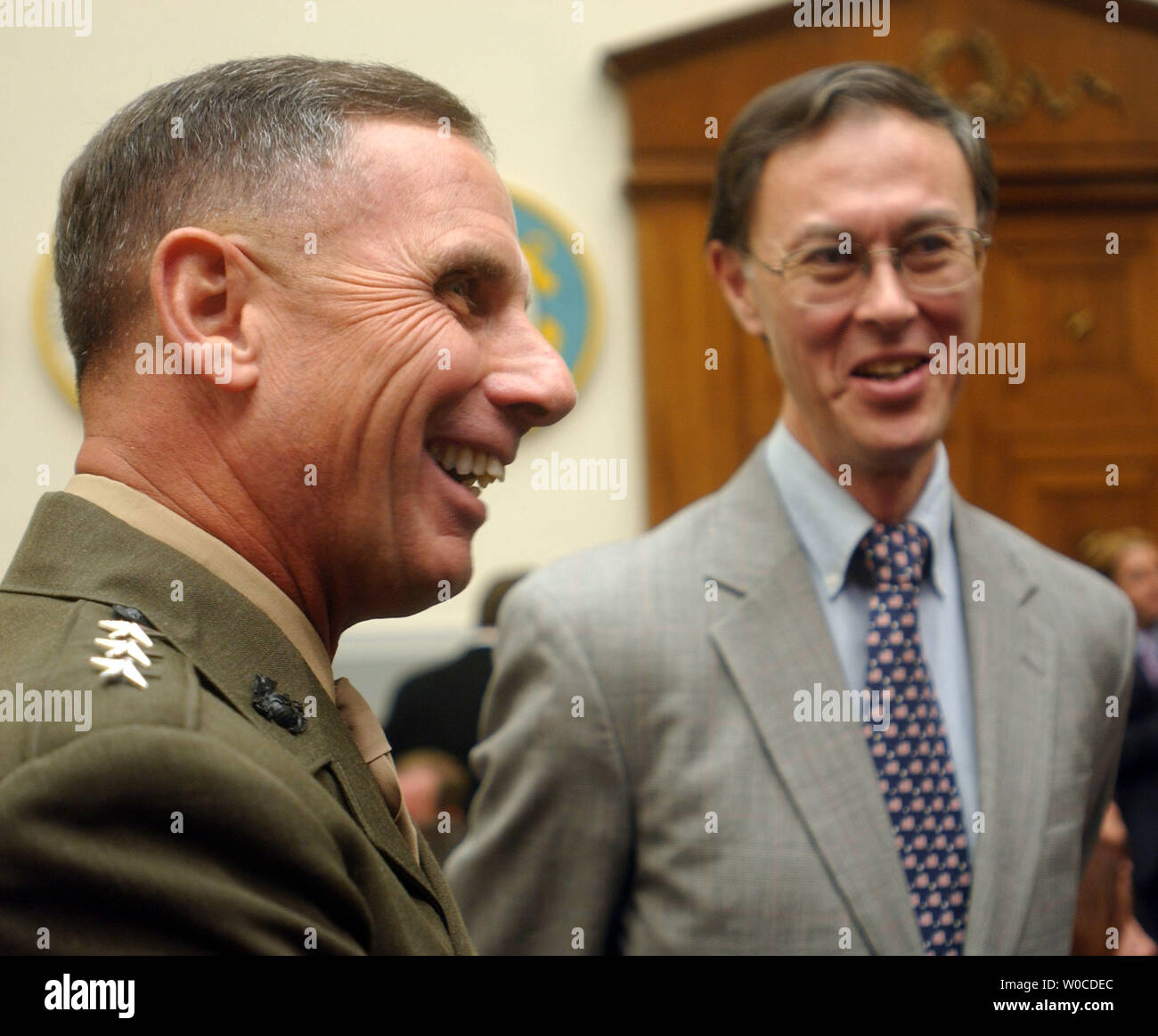 Lieutenant General Jan Huly of the Marine Corps has a laugh with David Chu, Under Secretary of Defense, before the House Armed Services Committee started its hearing on July 7, 2004 in Washington.  The Committee is looking into troop size and strength abroad as well as the readyness of the Reserve at home. (UPI Photo/Michael Kleinfeld) Stock Photo