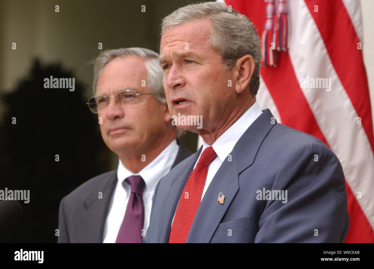 President George W. Bush announces to members of the press that he is nominating Rep. Porter Goss, left, R-FL, as the new head of the CIA, on August 10, 2004 in Washington. Goss is a former member of the CIA and sits on the House of Representatives Intelligence Committee. (UPI Photo/Michael Kleinfeld) Stock Photo